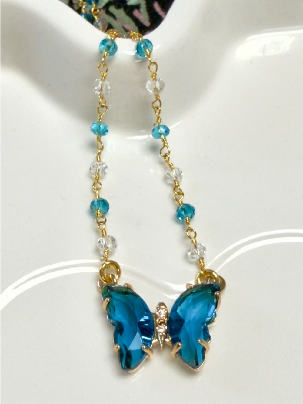 Gold-Tone Necklace with Blue Crystal Butterfly Pendant